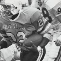 Grand valley football player running with the ball.